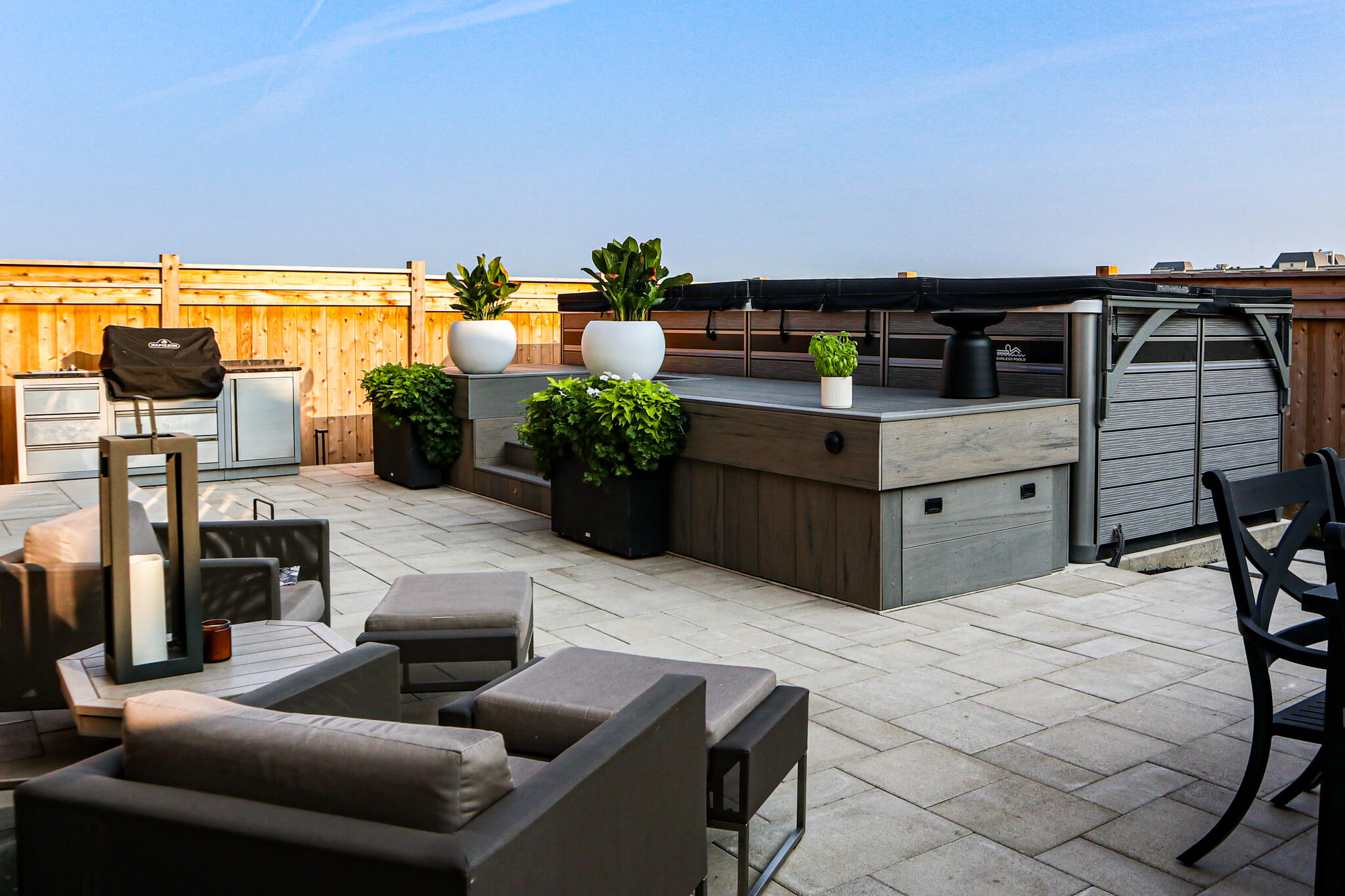 Residential landscaping project in Hamilton – outdoor living space with lounge space, lap pool, and BBQ