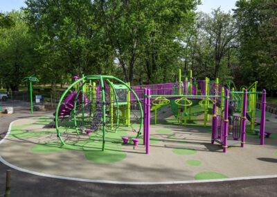 Green and Purple playground with a climbing structure at Mohawk Park in Brantford