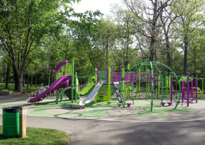 Green and purple playground with slides and monkey bars at Mohawk Park in Brantford