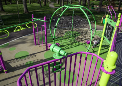 Green and purple playground with telescope at Mohawk Park in Brantford
