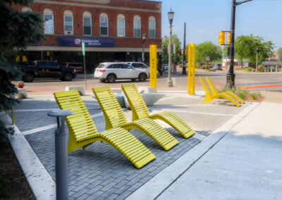 Yellow metal lounge chairs at Welland Parkette