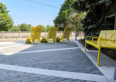 Yellow metal lounge chairs overlooking the Welland Canal