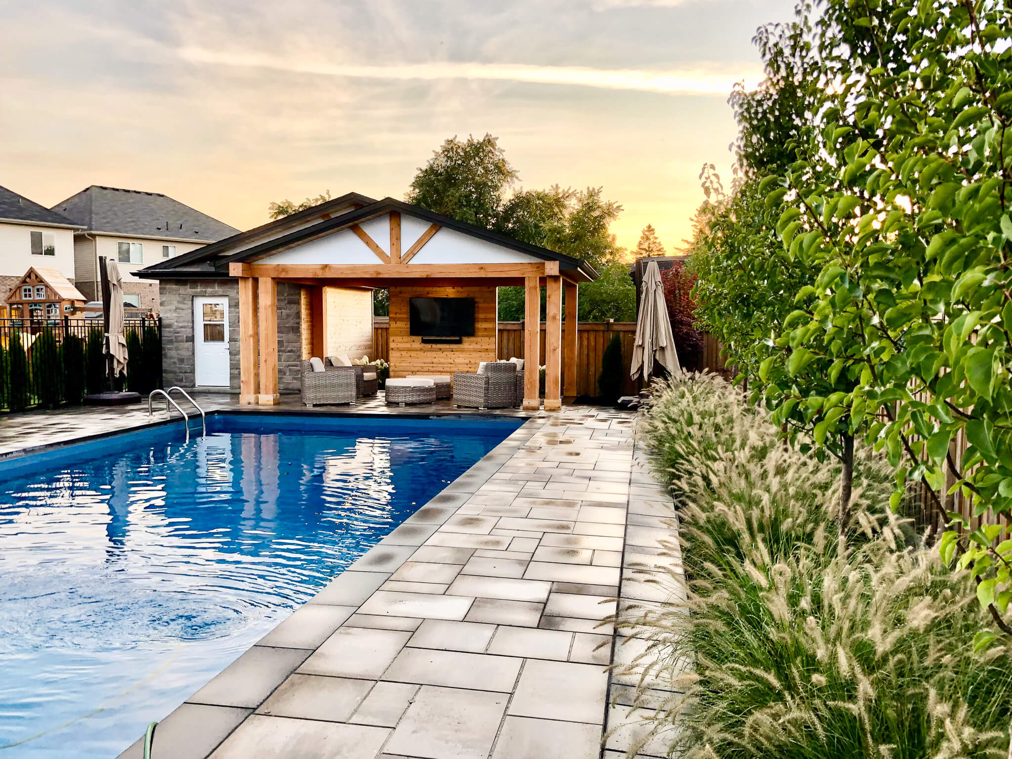 Pool and pergola entertainment space Outdoor entertaining space with a pool, pergola, outdoor lounge with a tv
