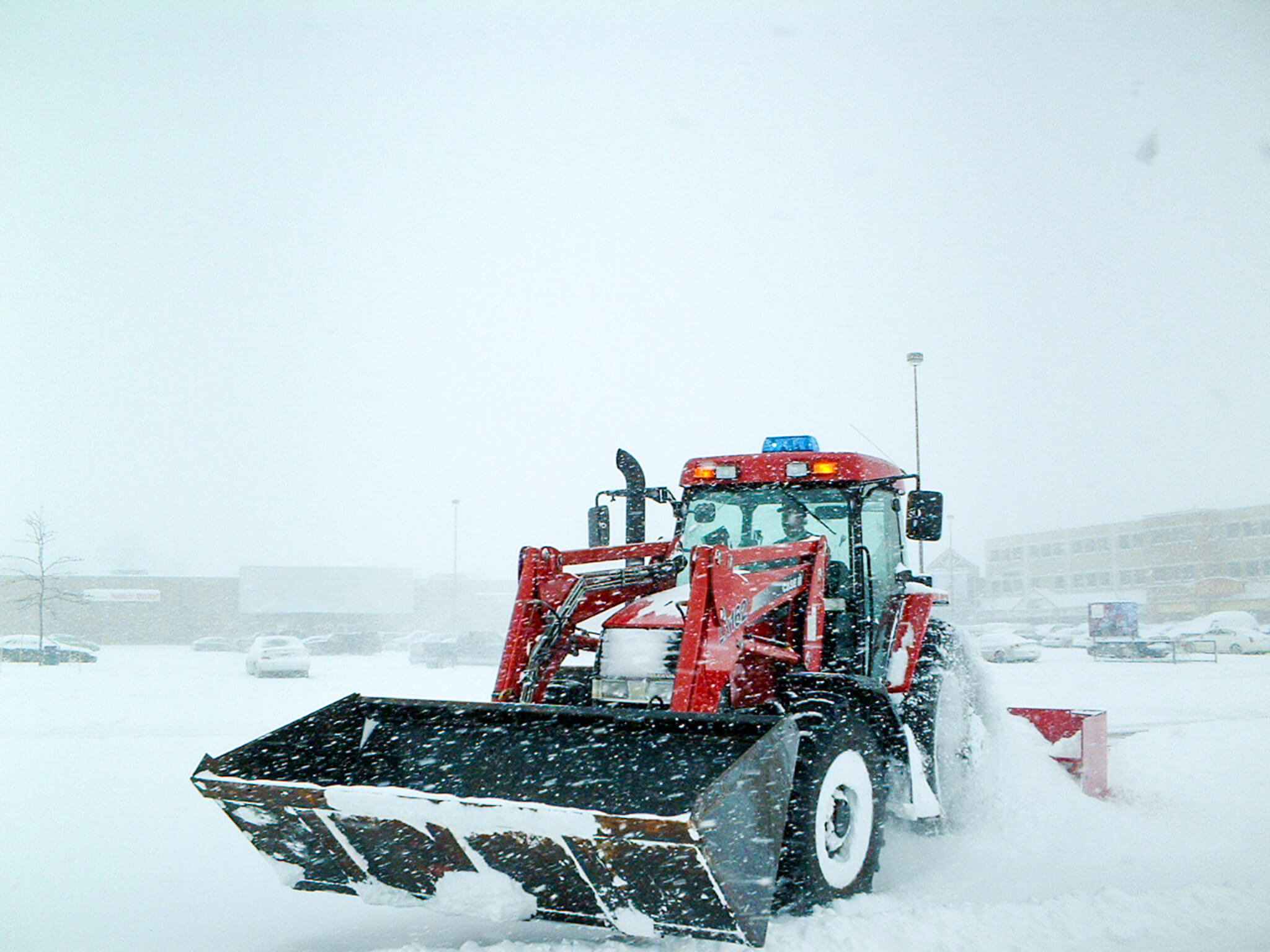 Commercial Snow Removal Hamilton Heavy snowfall with tractor plowing